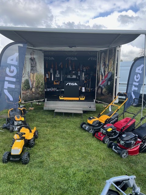 Stiga display trailer and mowers at a show