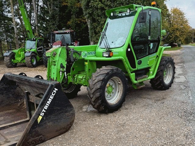 Merlo P34.7 telehandler with a Strimech bucket on the yard